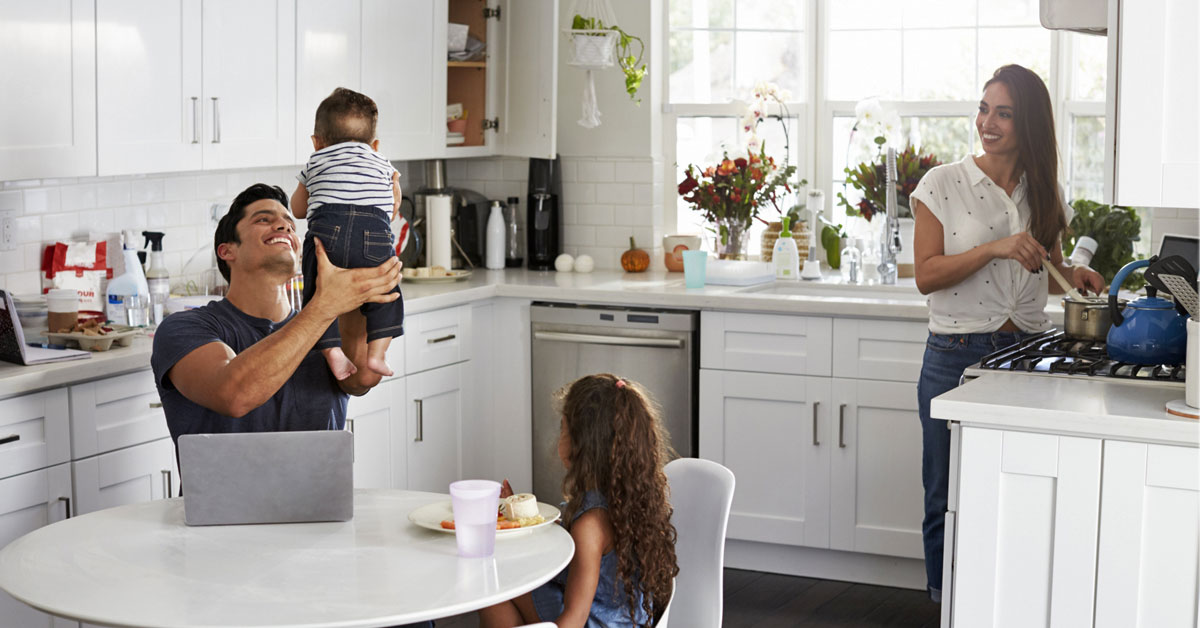 Image of a family hanging out in their kitchen
